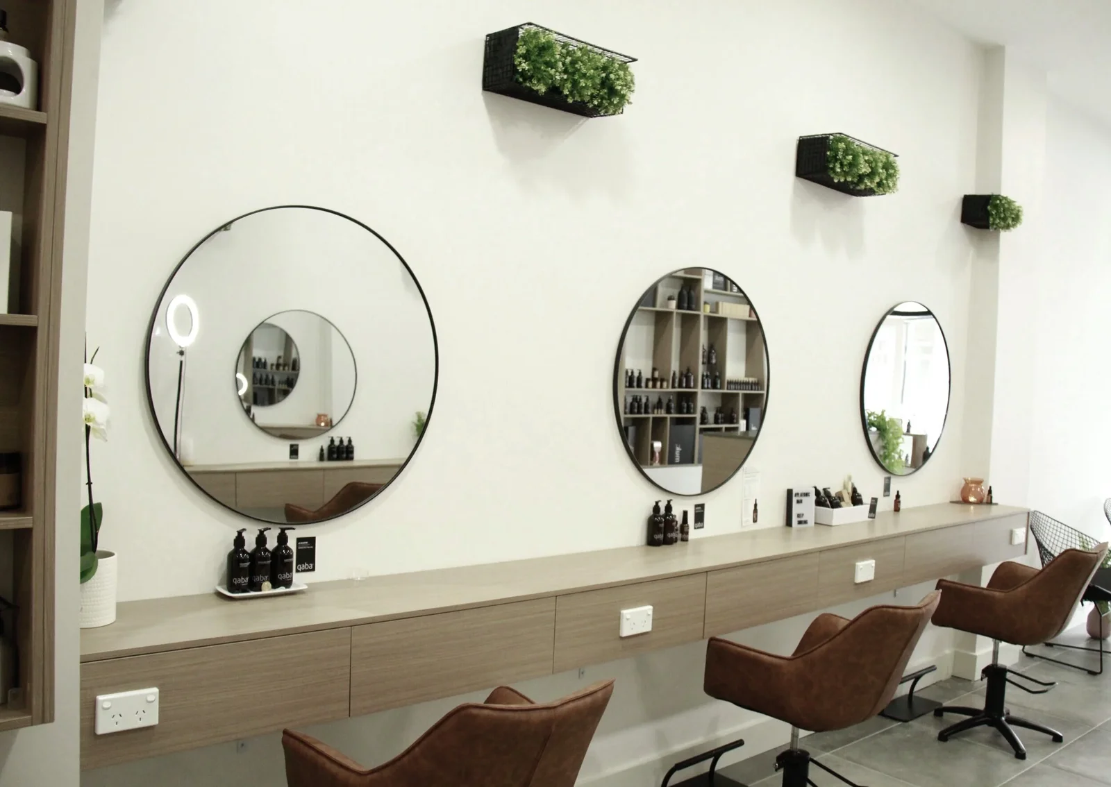 Platonic Hair Studio — three round mirrors with qaba products, Hawthorn