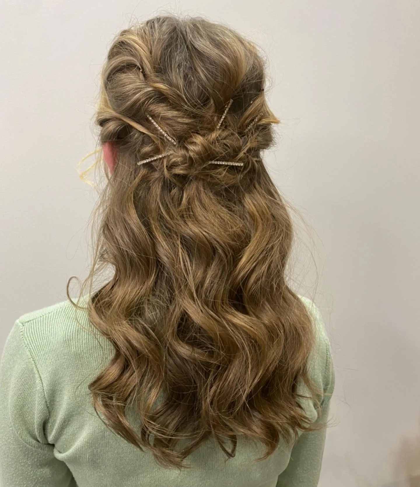 Event updo with crystal pins and loose waves